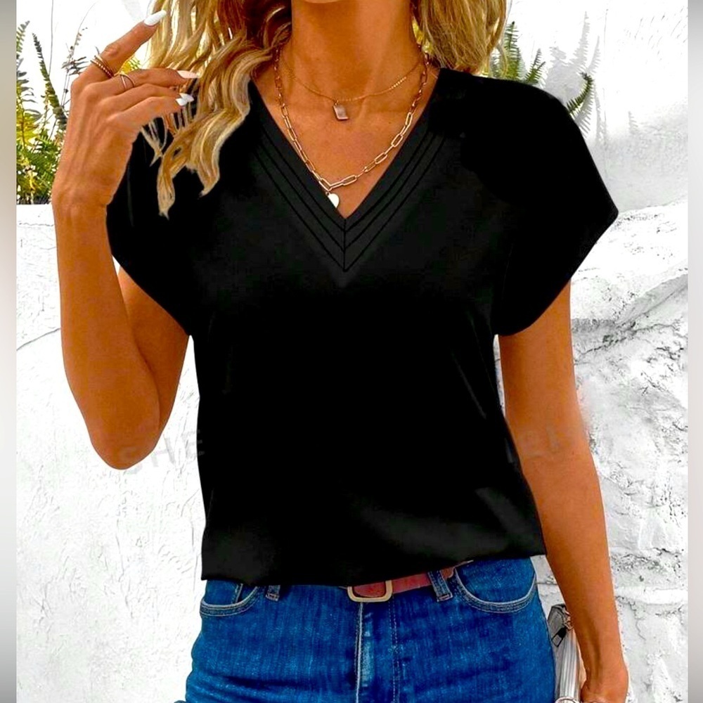 NWT- Classy black bat-wing sleeve blouse.